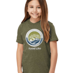 Smiling girl wearing an olive-green Forest Lake logo T-shirt.
