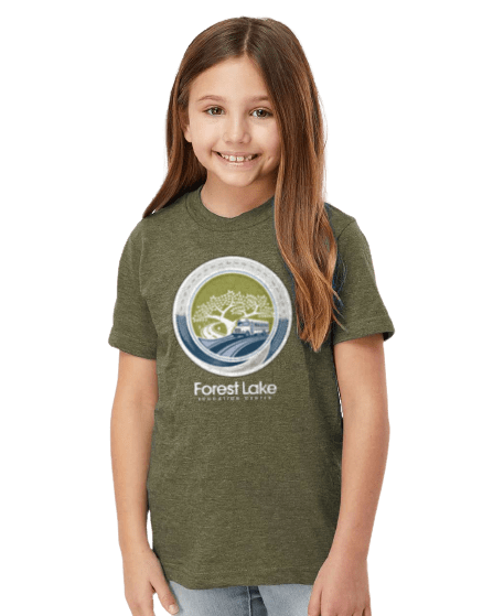 Smiling girl wearing an olive-green Forest Lake logo T-shirt.