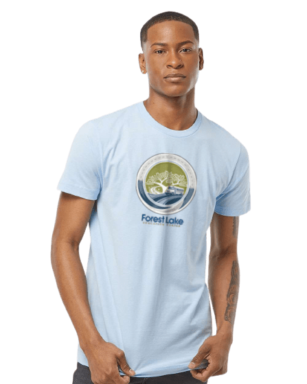 Young man wearing a light blue t-shirt with a circular Forest Lake logo on the chest.